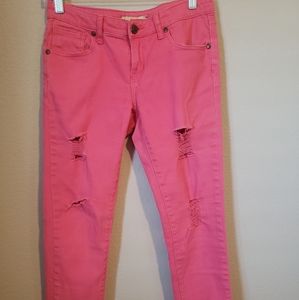 Pink distressed jeans